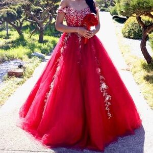 Elegant Red Gown with Intricate Silver Embellishments